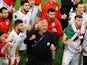 Tajikistan manager Petar Segrt celebrates with his team after their round of 16 victory at the Asian Cup